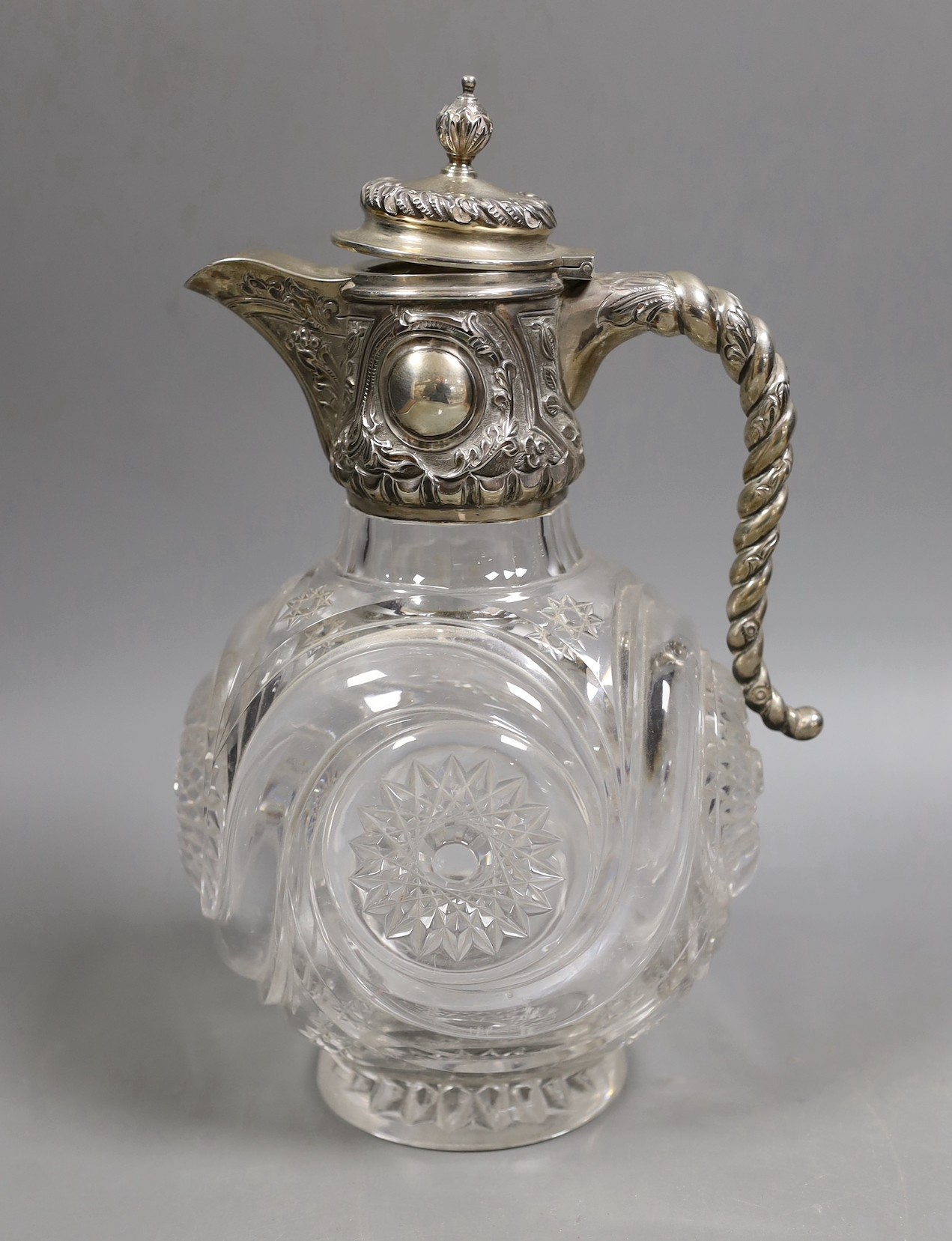 An Edwardian silver mounted cut glass claret jug, John Grinsell & Sons, Birmingham, 1902, 26cm.